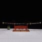 Katana japonais Shusui complet avec fourreau noir décoré de symboles rouges, lame forgée main.